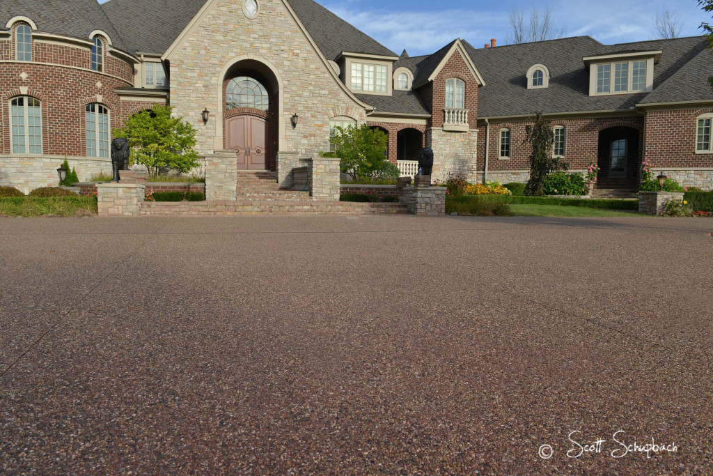 Exposed Peastone Aggregate with Coral Red integral color Peastone with Coral Red integral color Driveway