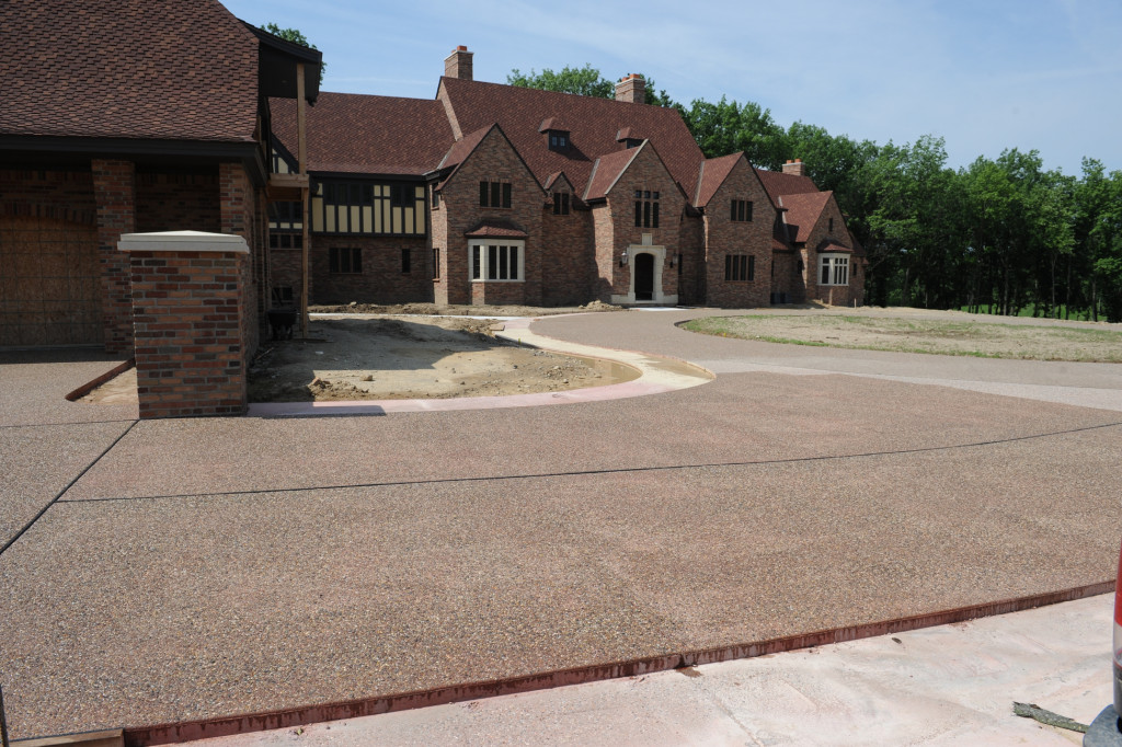 Exposed Peastone Aggregate with Coral Red integral color